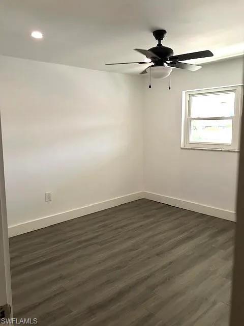 200 Valley Stream Drive, Unit 8B Naples, FL 34113 - Photo 11 of 15 Well-lit room featuring a window, a ceiling fan with integrated lighting, a recessed light fixture, and plank flooring