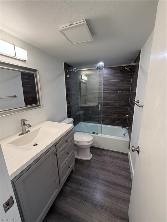 200 Valley Stream Drive, Unit 8B Naples, FL 34113 - Photo 11 of 21 a bathroom with a sink toilet mirror and shower