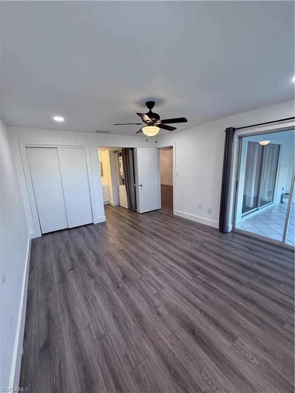 200 Valley Stream Drive, Unit 8B Naples, FL 34113 - Photo 14 of 21 a view of a room with wooden floor and white walls