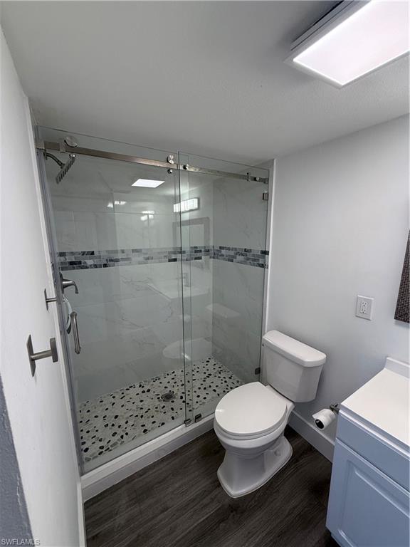 200 Valley Stream Drive, Unit 8B Naples, FL 34113 - Photo 16 of 21 a bathroom with a toilet and a shower