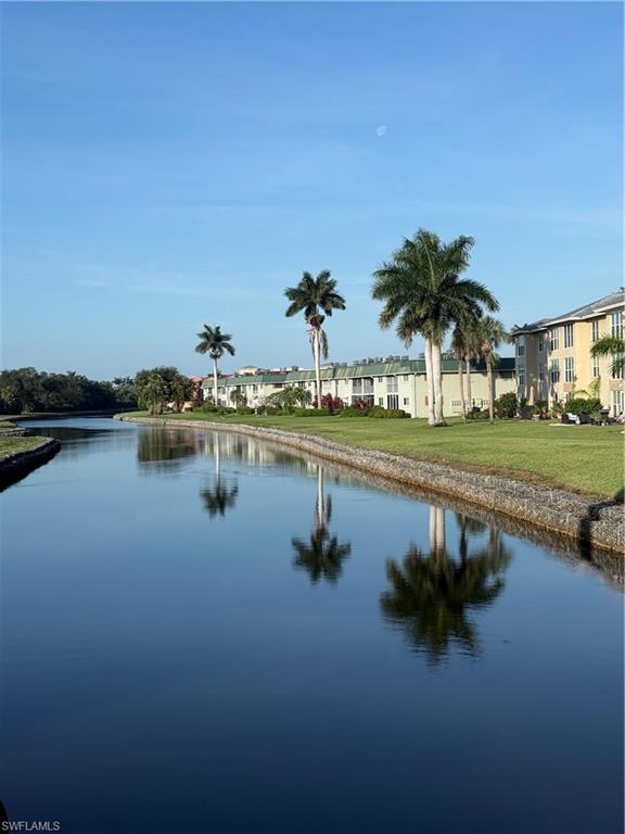 200 Valley Stream Drive, Unit 8B Naples, FL 34113 - Photo 19 of 21 a view of a lake with houses in outdoor space