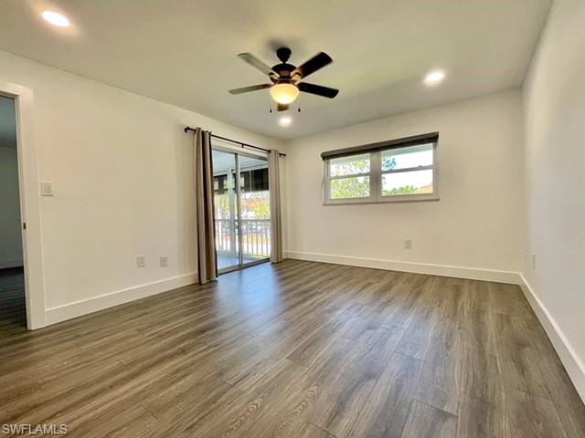 200 Valley Stream Drive, Unit 8B Naples, FL 34113 - Photo 7 of 15 This room features wood-look flooring, white walls, recessed lighting, and a ceiling fan with an integrated light fixture