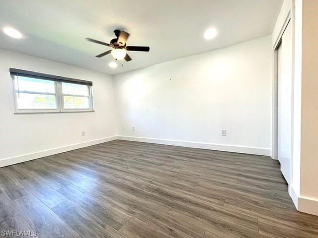 200 Valley Stream Drive, Unit 8B Naples, FL 34113 - Photo 8 of 15 This room features wood-look flooring, a window with blinds, and recessed lighting
