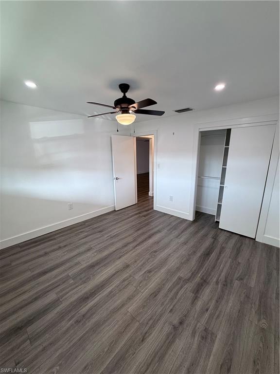200 Valley Stream Drive, Unit 8B Naples, FL 34113 - Photo 8 of 21 a view of empty room with wooden floor
