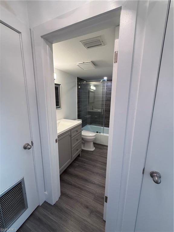 200 Valley Stream Drive, Unit 8B Naples, FL 34113 - Photo 10 of 21 a bathroom with a sink a toilet and shower