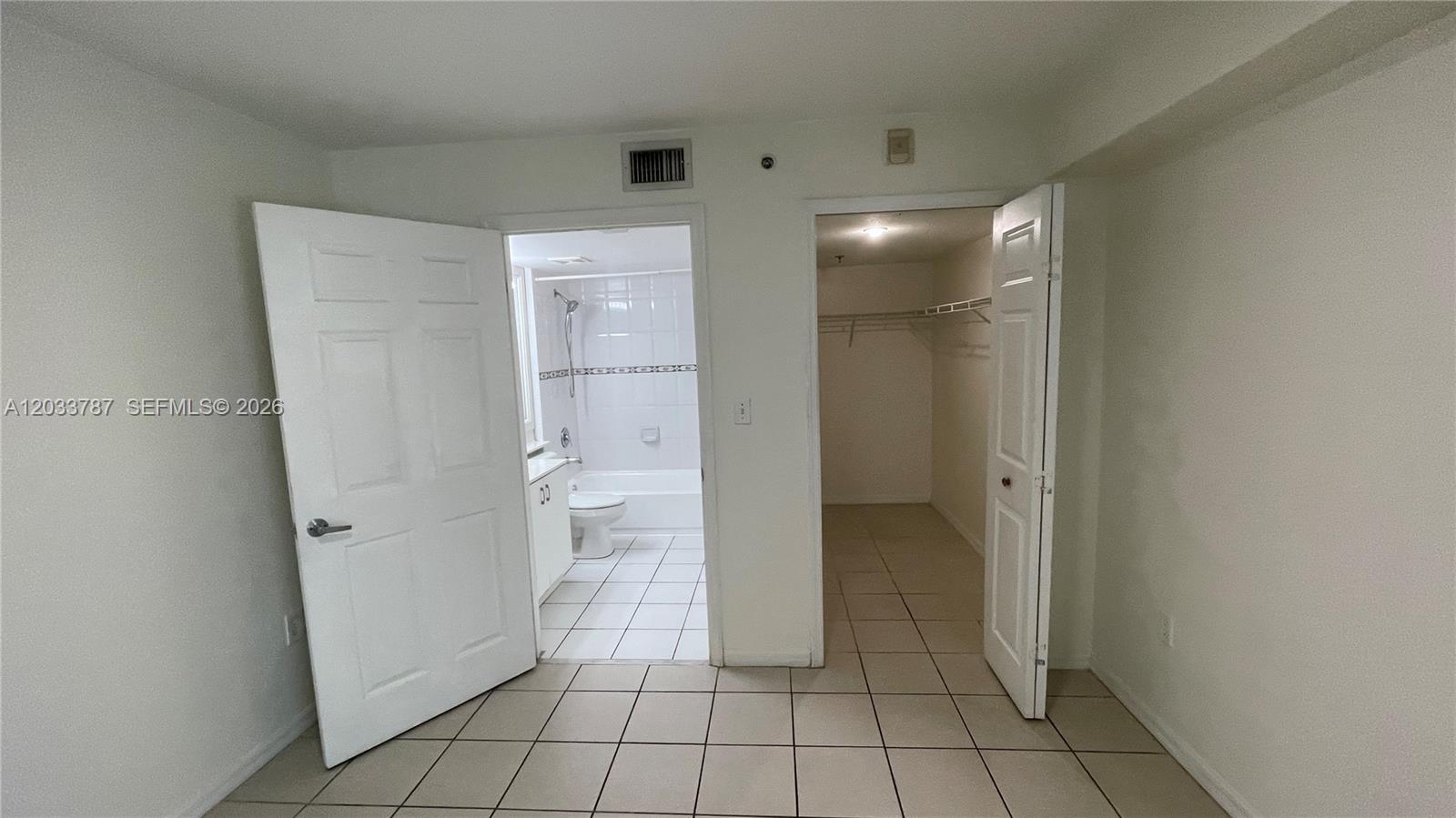 2475 Northwest 16th St Road, Unit 309 Miami, FL 33125 - Photo 10 of 16 Primary Bedroom