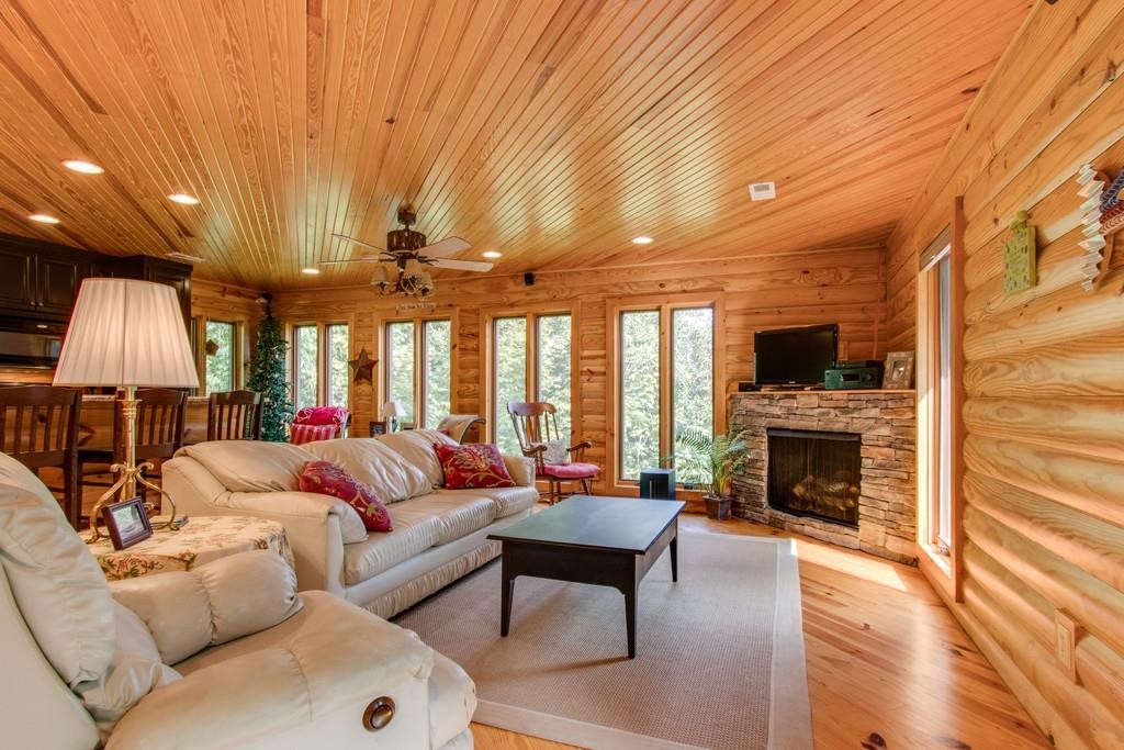 320 Captain Point Silver Point, TN 38582 - Photo 1 of 23 a living room with furniture a fireplace and a flat screen tv