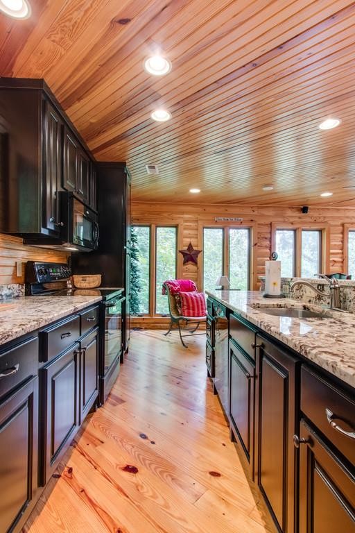 320 Captain Point Silver Point, TN 38582 - Photo 12 of 23 a kitchen with stainless steel appliances granite countertop a sink stove and cabinets