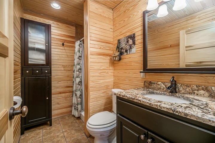 320 Captain Point Silver Point, TN 38582 - Photo 15 of 23 a bathroom with a granite countertop sink toilet and shower