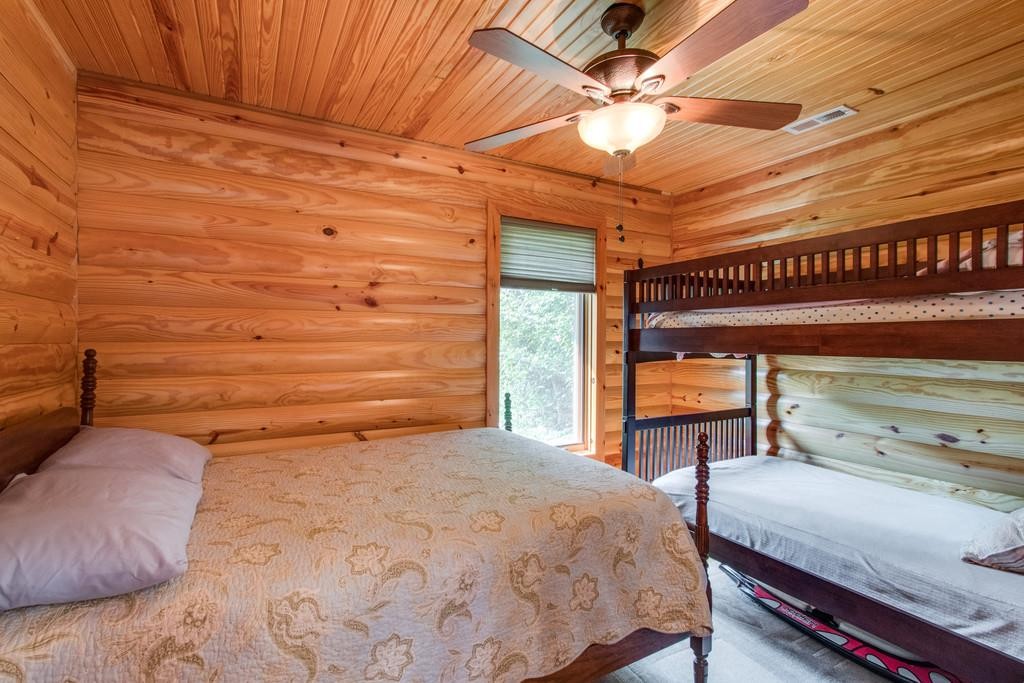 320 Captain Point Silver Point, TN 38582 - Photo 17 of 23 a bedroom with a bed and a table