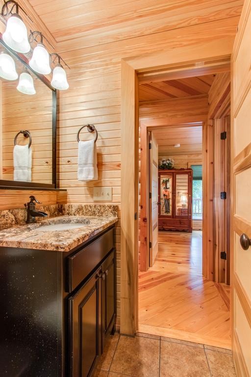 320 Captain Point Silver Point, TN 38582 - Photo 19 of 23 a bathroom with a granite countertop sink and a mirror
