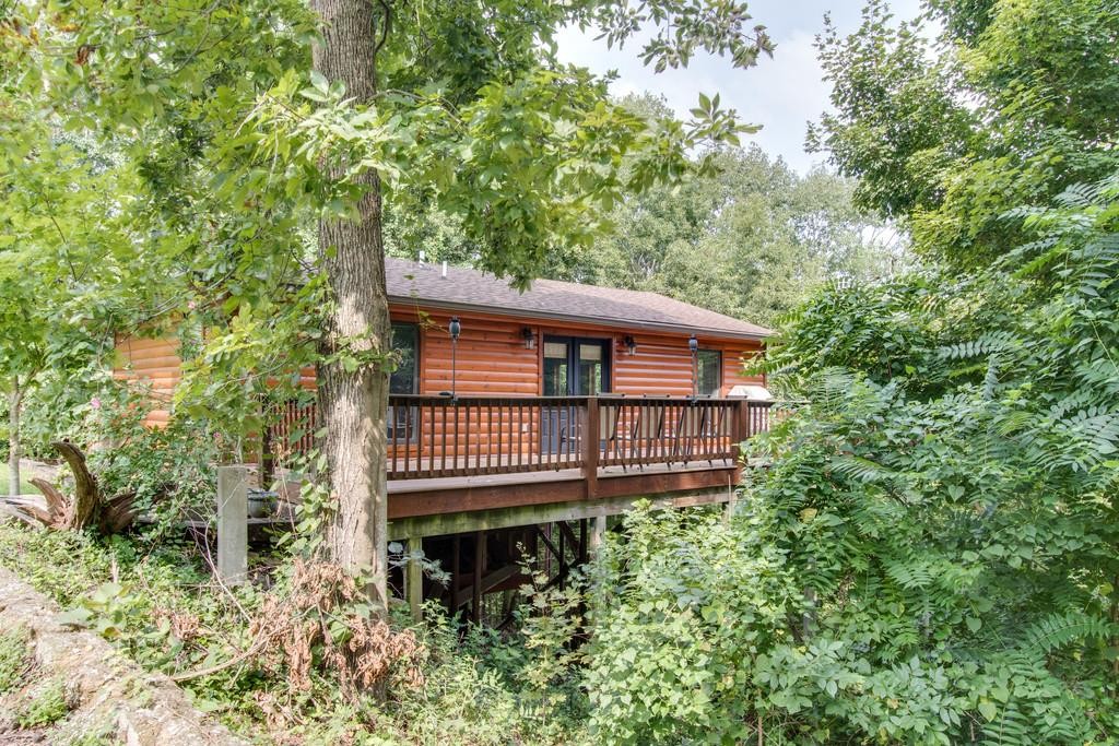 320 Captain Point Silver Point, TN 38582 - Photo 3 of 23 a view of a house with a roof deck