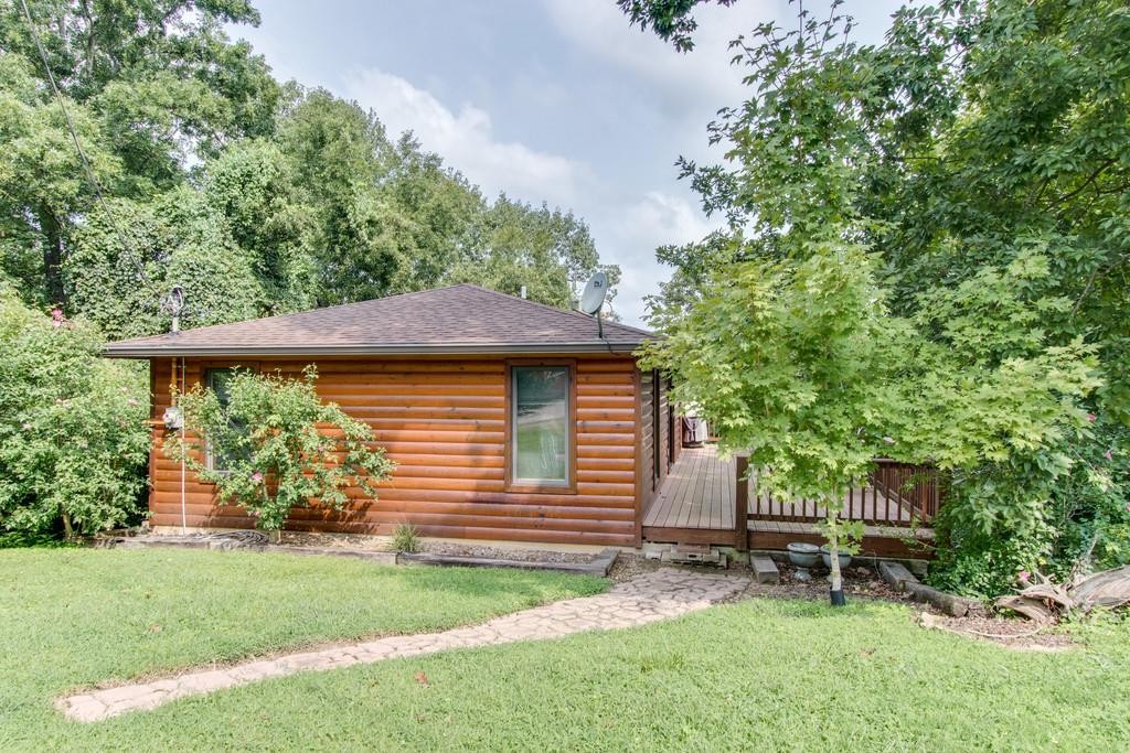 320 Captain Point Silver Point, TN 38582 - Photo 4 of 23 a backyard of a house with table and chairs