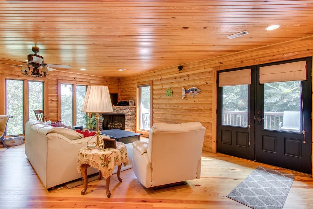 320 Captain Point Silver Point, TN 38582 - Photo 6 of 23 a living room with furniture a large window and wooden floor