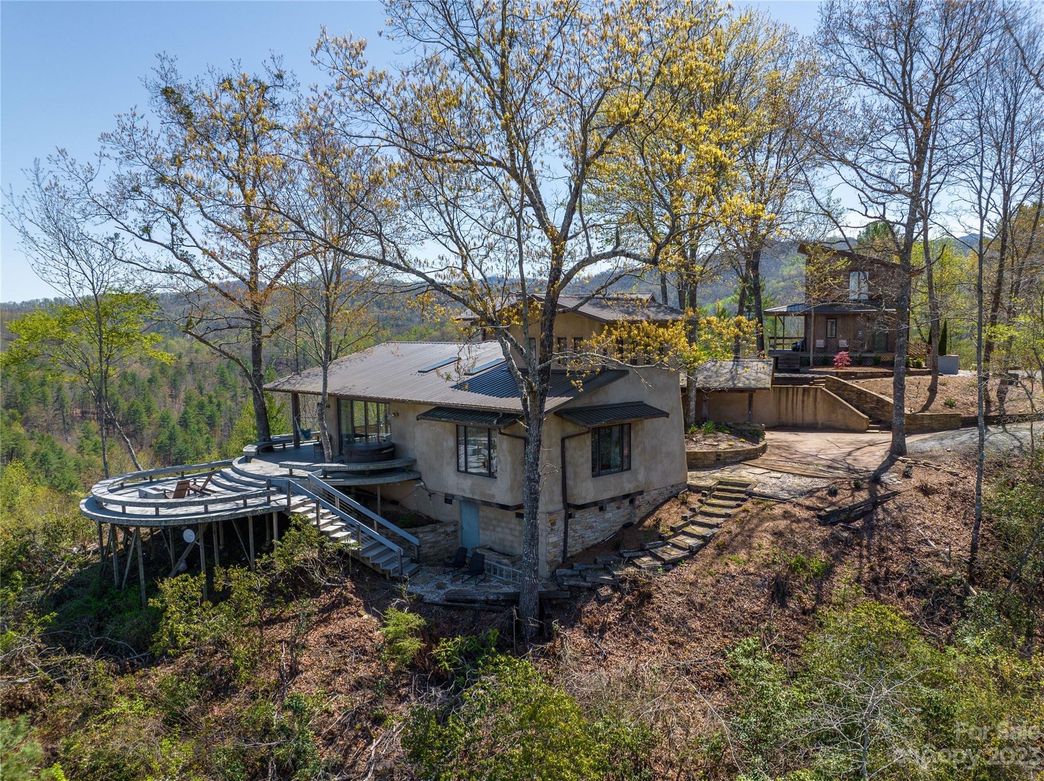 5013 Needmore Road Bryson City, NC 28713 - Photo 1 of 48 a view of a house with backyard and sitting area