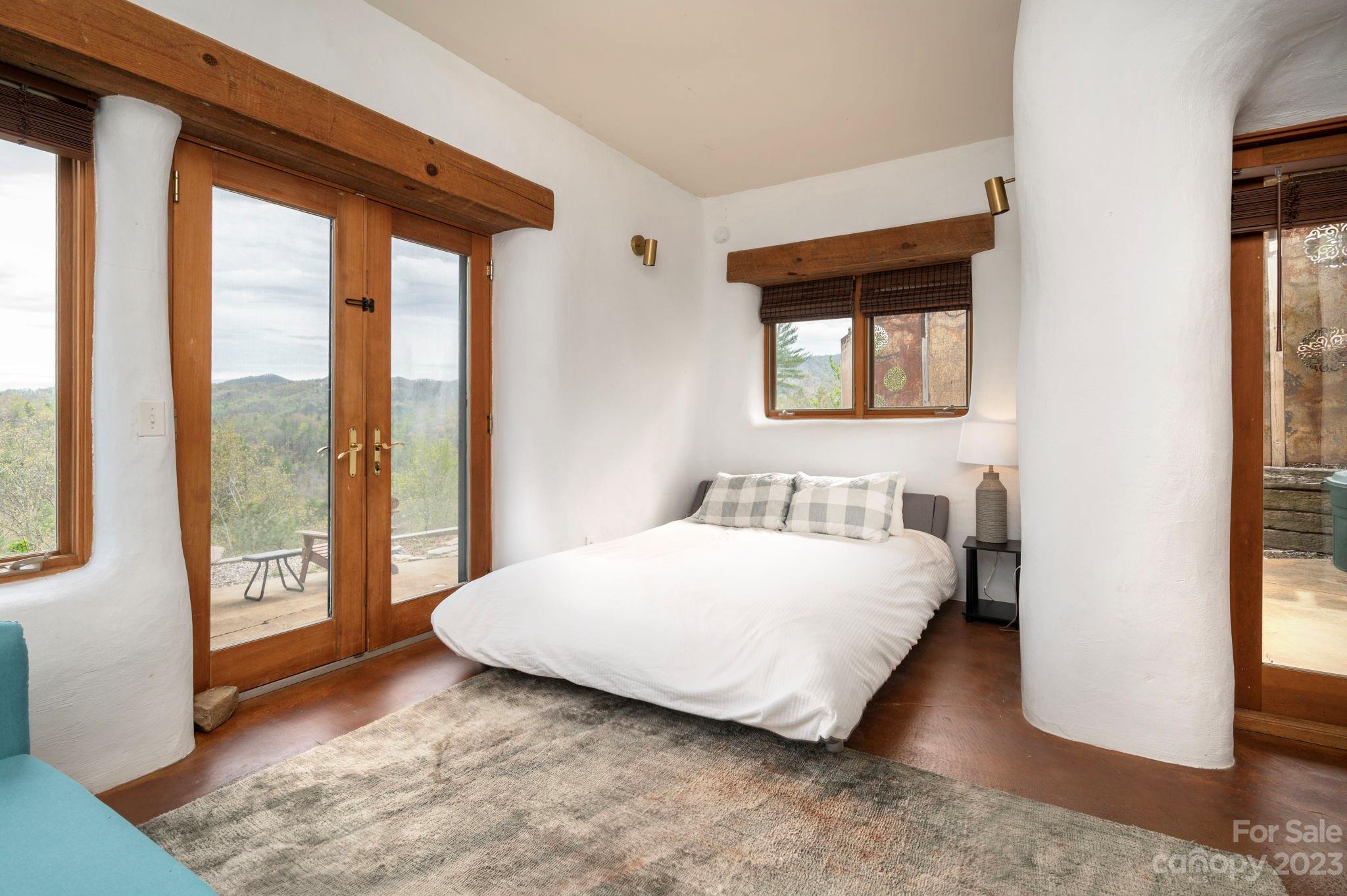 5013 Needmore Road Bryson City, NC 28713 - Photo 26 of 48 a bedroom with a bed and a large window