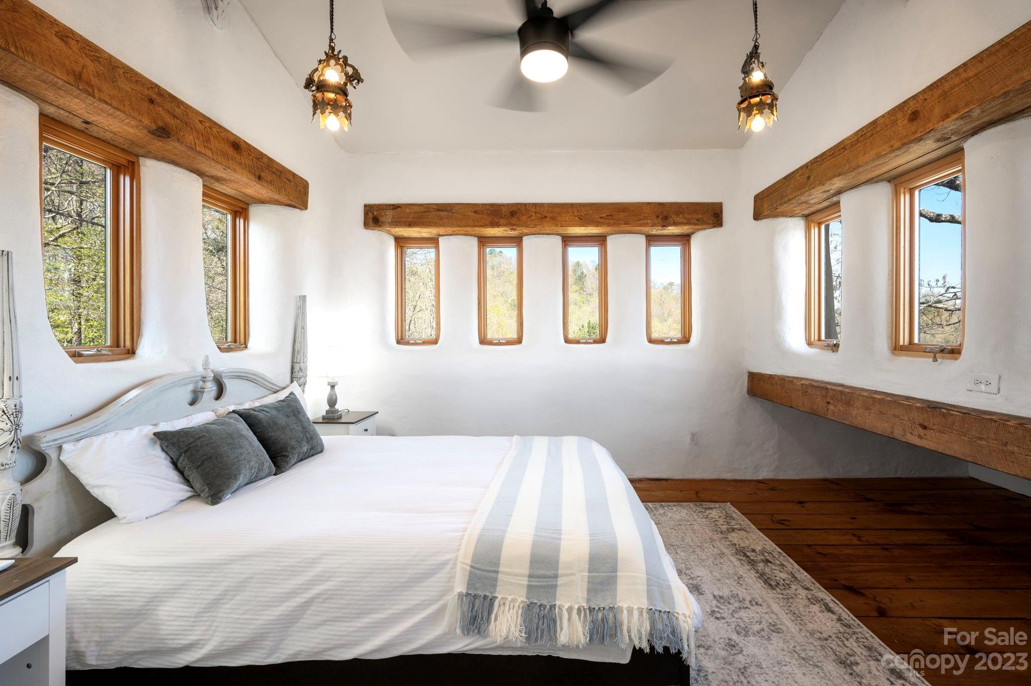5013 Needmore Road Bryson City, NC 28713 - Photo 28 of 48 a bedroom with a large bed and a window