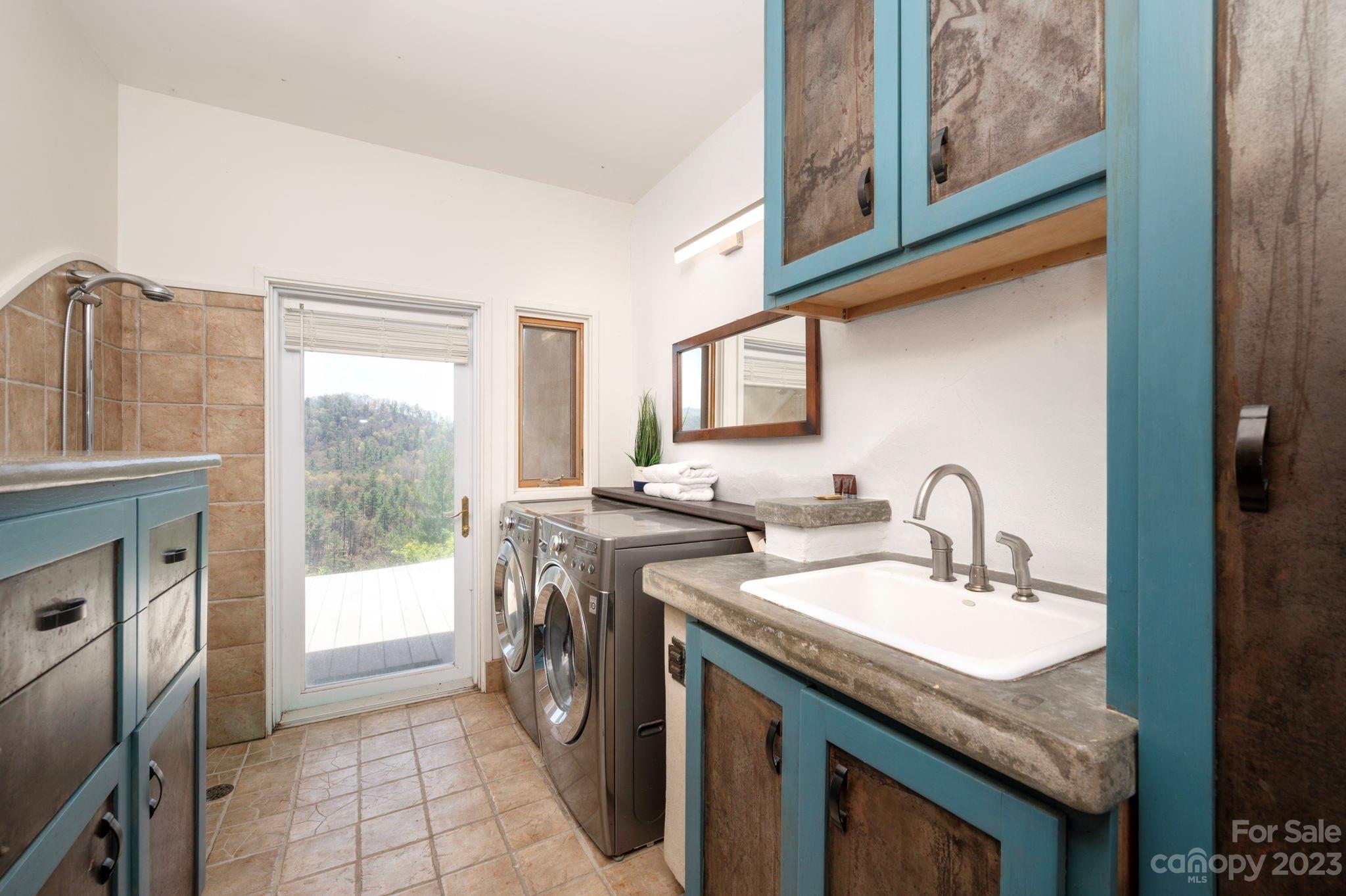 5013 Needmore Road Bryson City, NC 28713 - Photo 29 of 48 a kitchen with a sink stove and cabinets