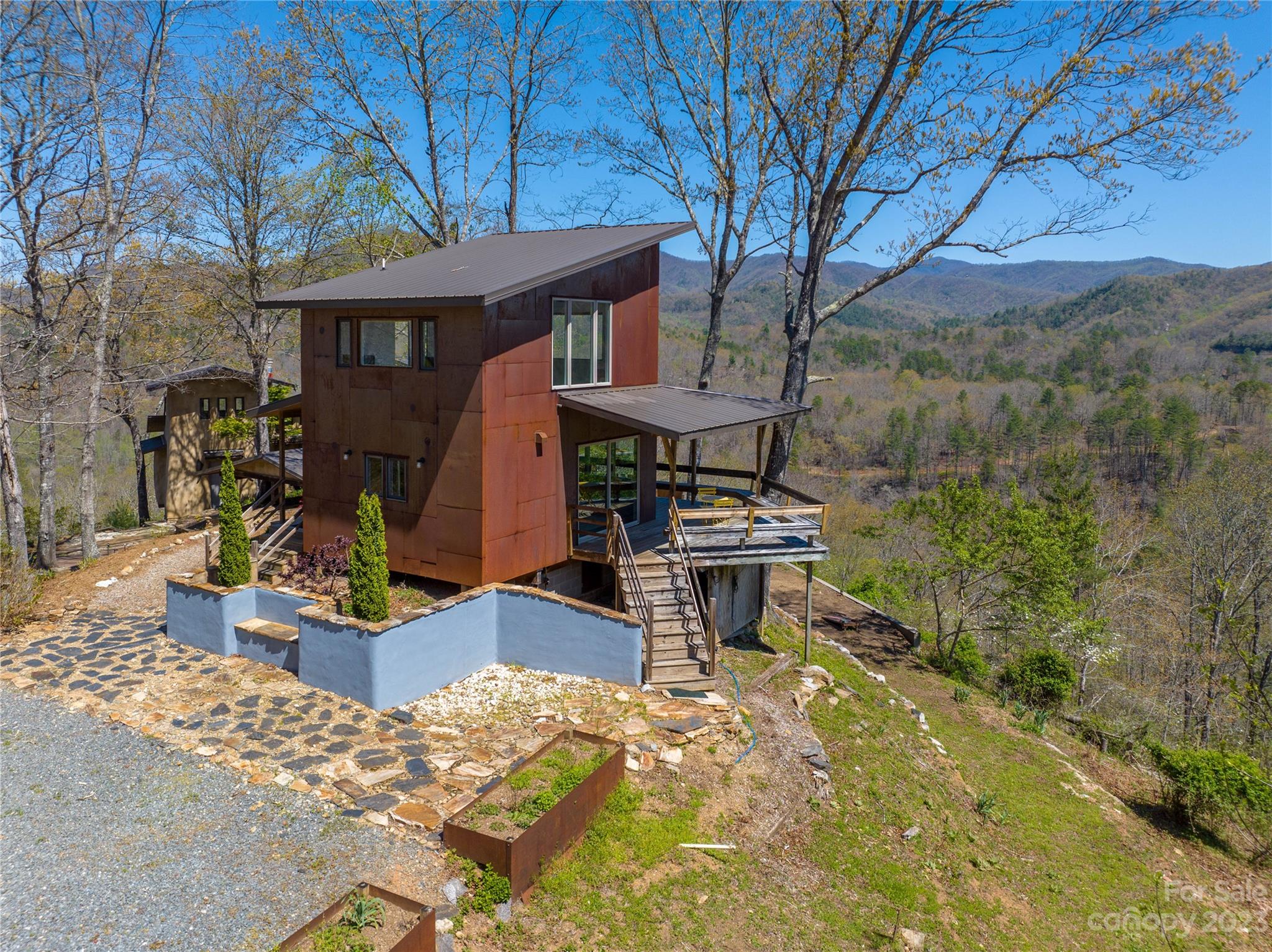 5013 Needmore Road Bryson City, NC 28713 - Photo 31 of 48 a front view of a house with garden