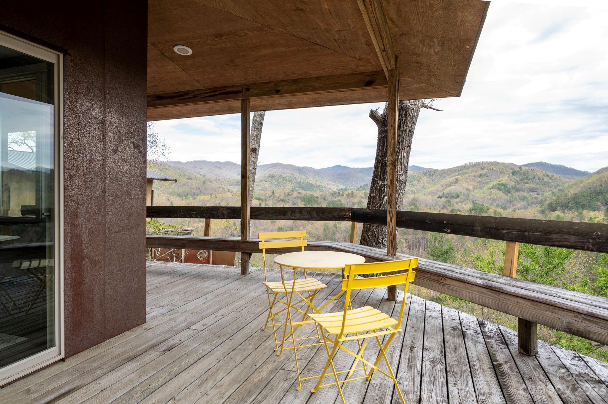 5013 Needmore Road Bryson City, NC 28713 - Photo 32 of 48 a view of a balcony with furniture and garden