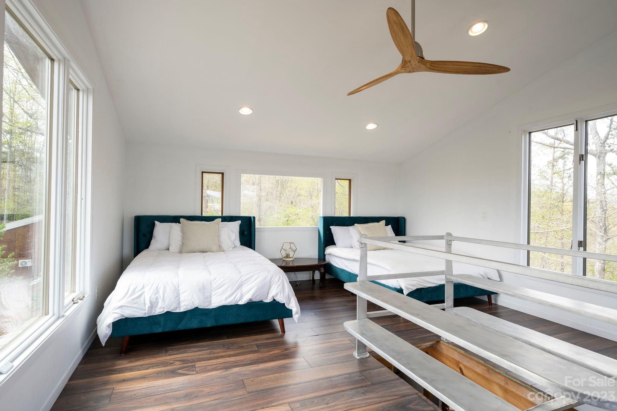 5013 Needmore Road Bryson City, NC 28713 - Photo 36 of 48 a spacious bedroom with a bed and a large window