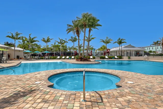 a view of a swimming pool with a lounge chair