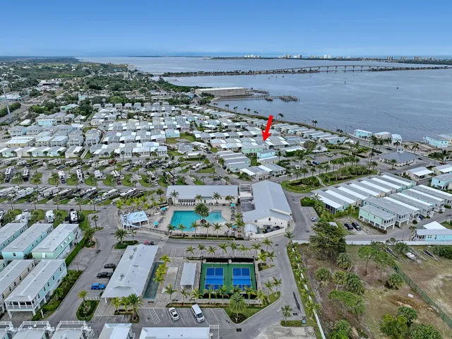 a view of a balcony with wooden floor