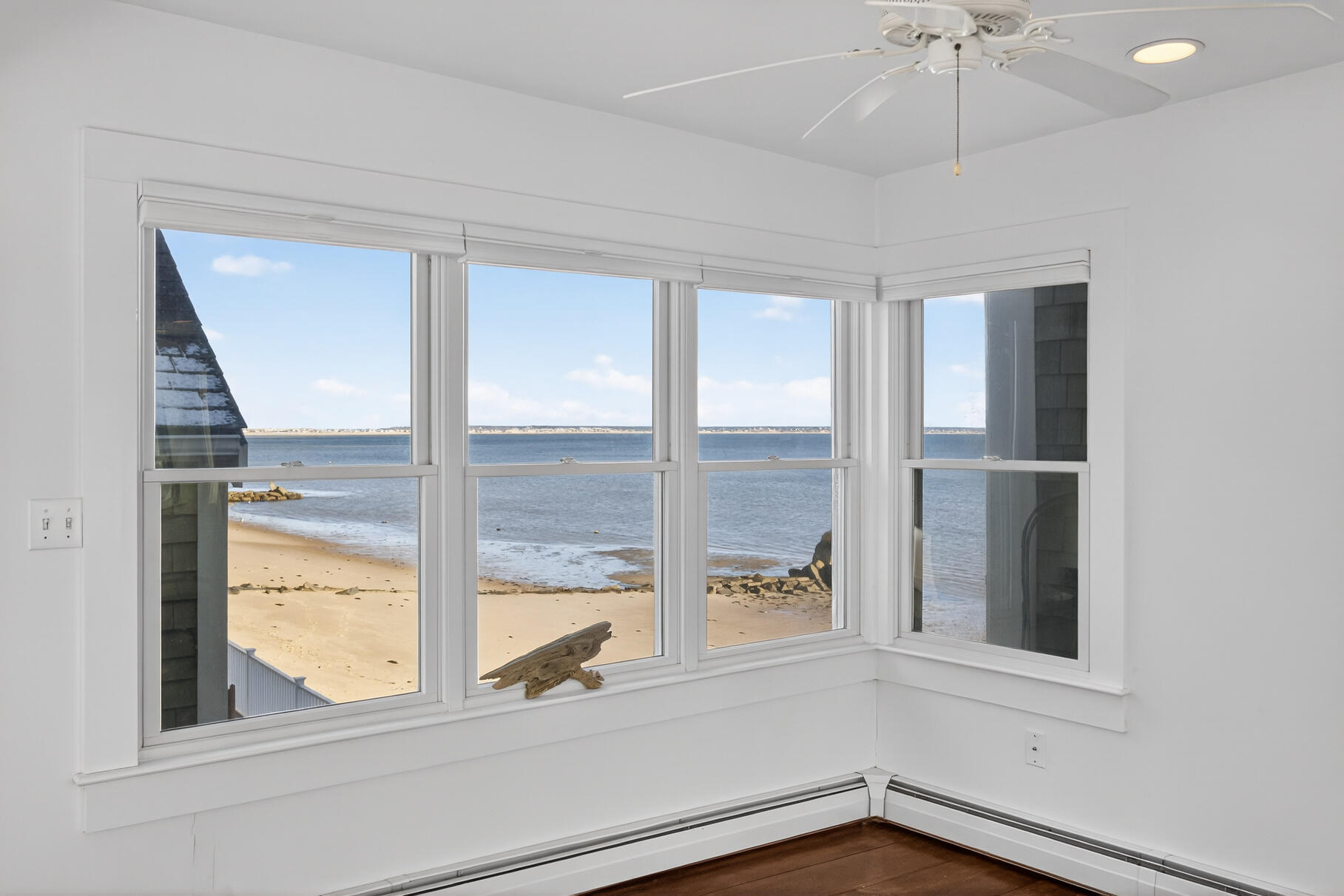 539 Commercial Street, Unit 3 Provincetown, MA 02657 - Photo 17 of 29 a view of a livingroom with a ceiling fan and window
