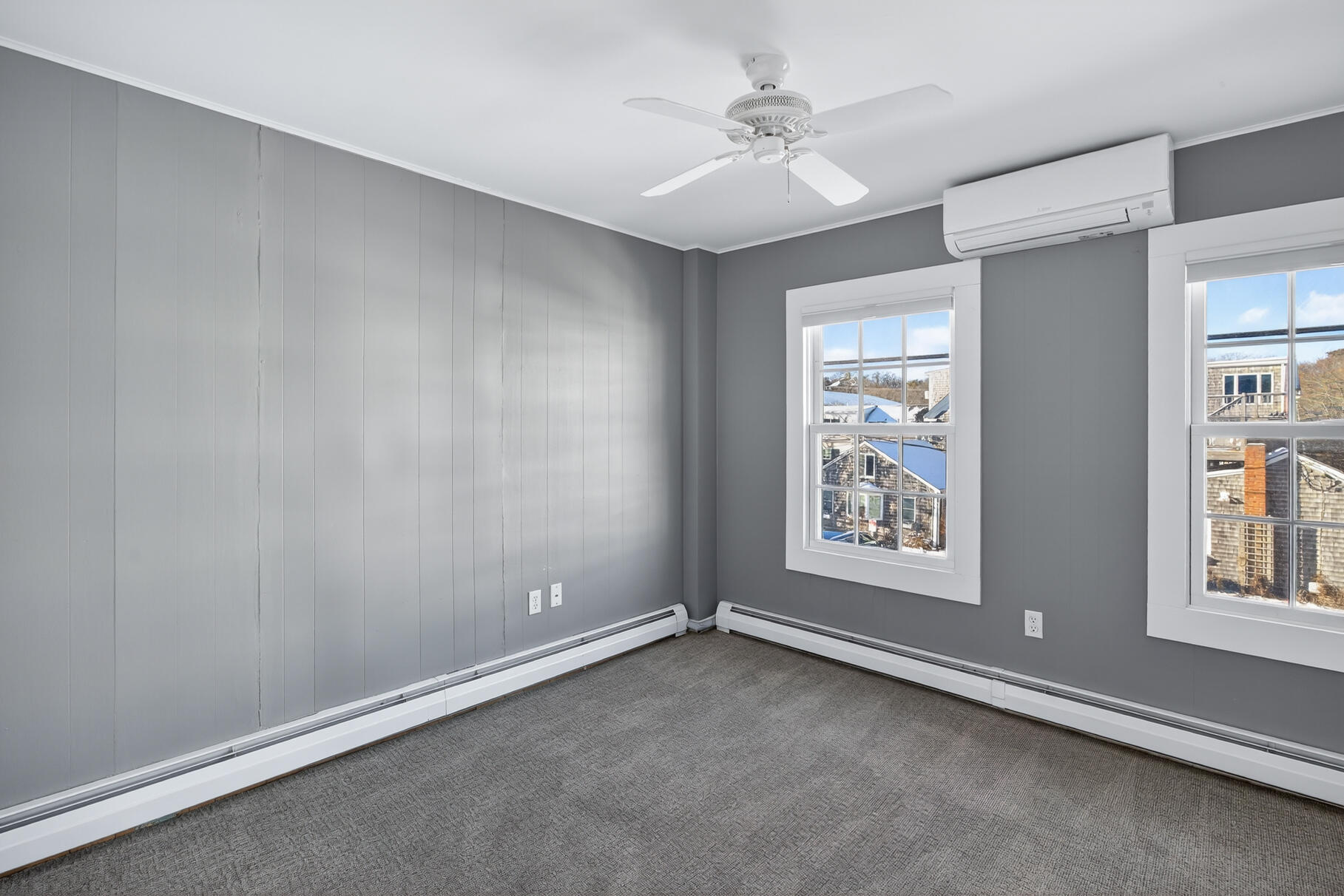 539 Commercial Street, Unit 3 Provincetown, MA 02657 - Photo 19 of 29 an empty room with windows and fan