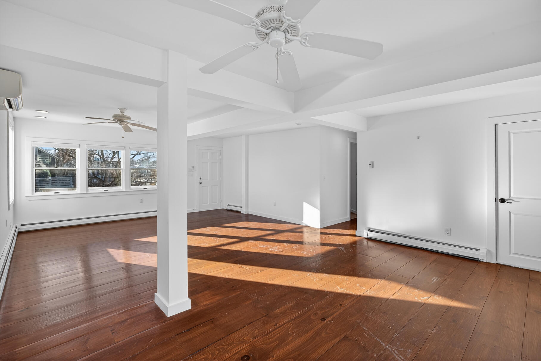 539 Commercial Street, Unit 3 Provincetown, MA 02657 - Photo 2 of 29 a view of empty room with wooden floor and fan