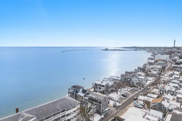 a view of a room with water heater and wooden floor