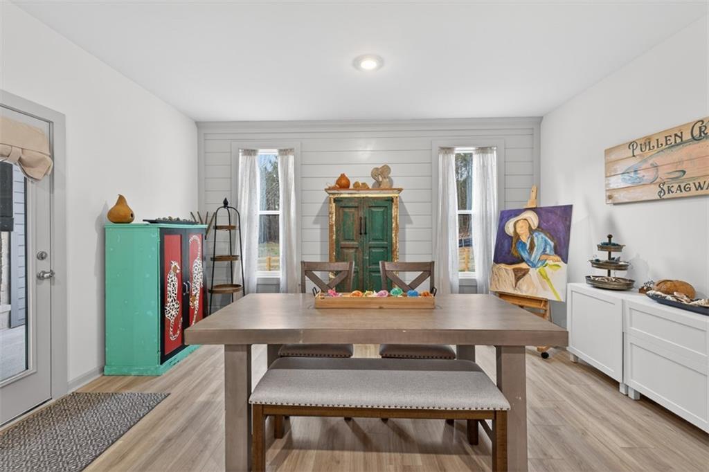 311 Rockwell Church Road Northwest Winder, GA 30680 - Photo 16 of 55 a living room with furniture and a book shelf