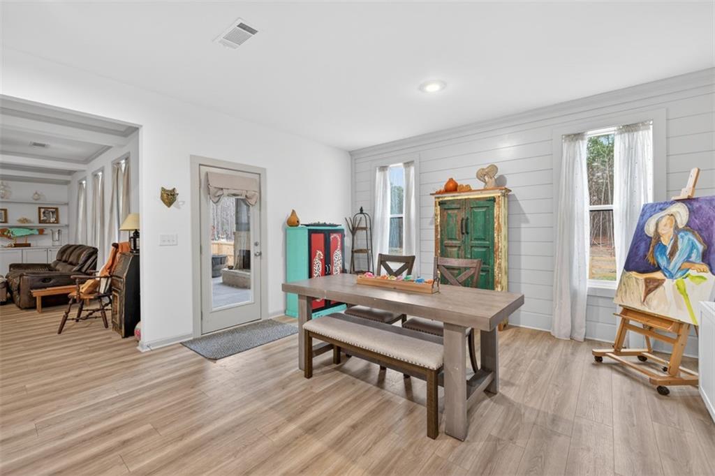 311 Rockwell Church Road Northwest Winder, GA 30680 - Photo 17 of 55 a room with furniture and a wooden floor