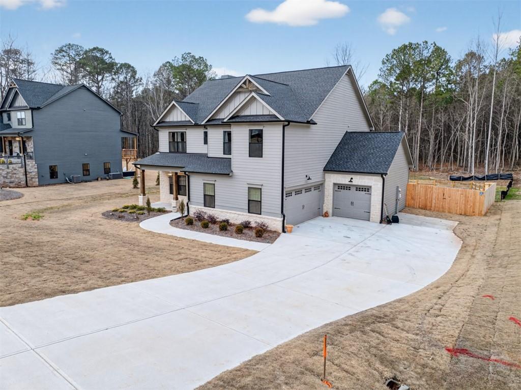 311 Rockwell Church Road Northwest Winder, GA 30680 - Photo 2 of 55 a front view of a house with a yard
