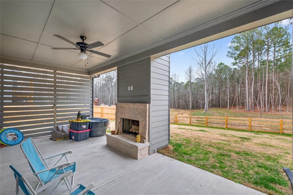 311 Rockwell Church Road Northwest Winder, GA 30680 - Photo 41 of 55 a living room with furniture and a fireplace