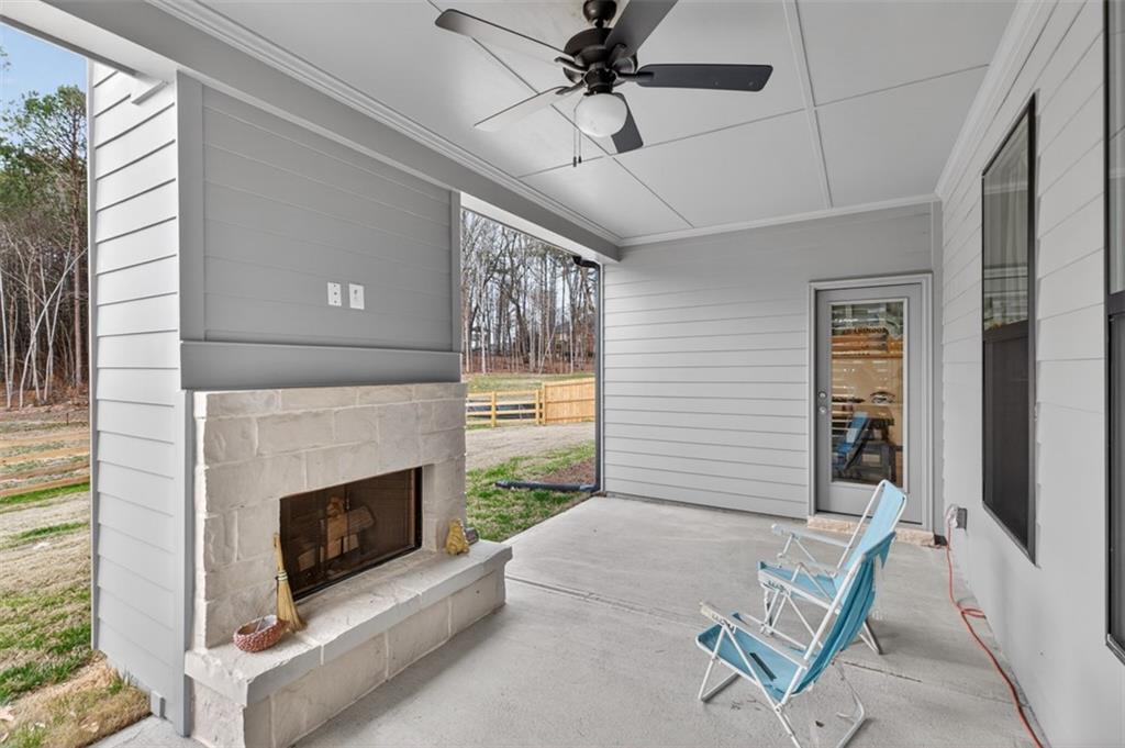 311 Rockwell Church Road Northwest Winder, GA 30680 - Photo 42 of 55 a living room with furniture and a fireplace