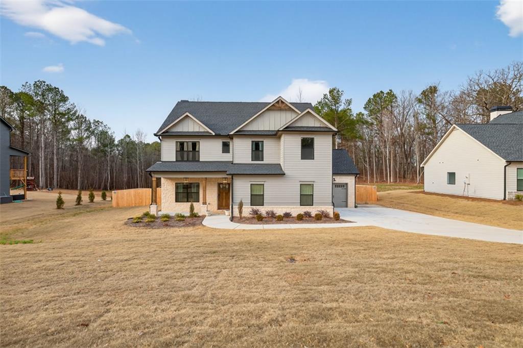 311 Rockwell Church Road Northwest Winder, GA 30680 - Photo 43 of 55 a front view of a house with a yard