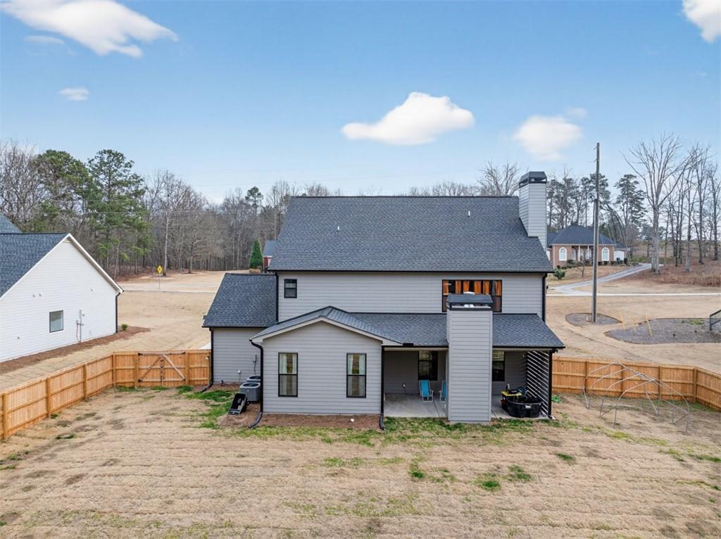 311 Rockwell Church Road Northwest Winder, GA 30680 - Photo 44 of 55 a view of a house with a yard