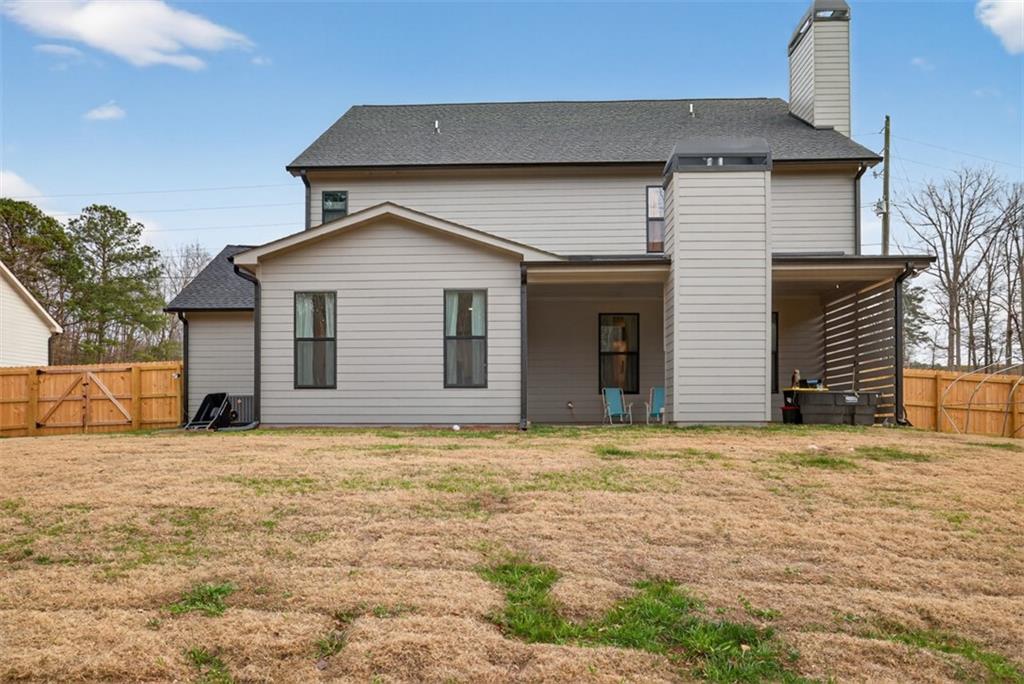 311 Rockwell Church Road Northwest Winder, GA 30680 - Photo 53 of 55 a house that has a large tree in front of it