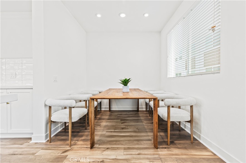 609 South Lyon Street Santa Ana, CA 92705 - Photo 11 of 36 a view of a dining room with furniture and wooden floor