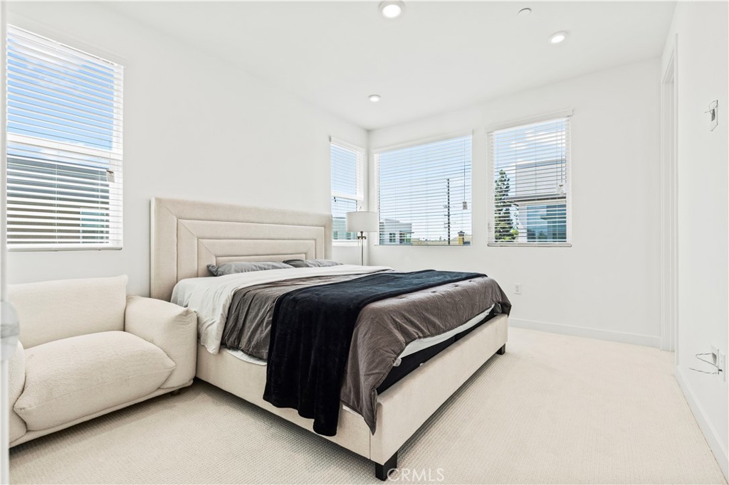 609 South Lyon Street Santa Ana, CA 92705 - Photo 17 of 36 a bedroom with a bed and a couch