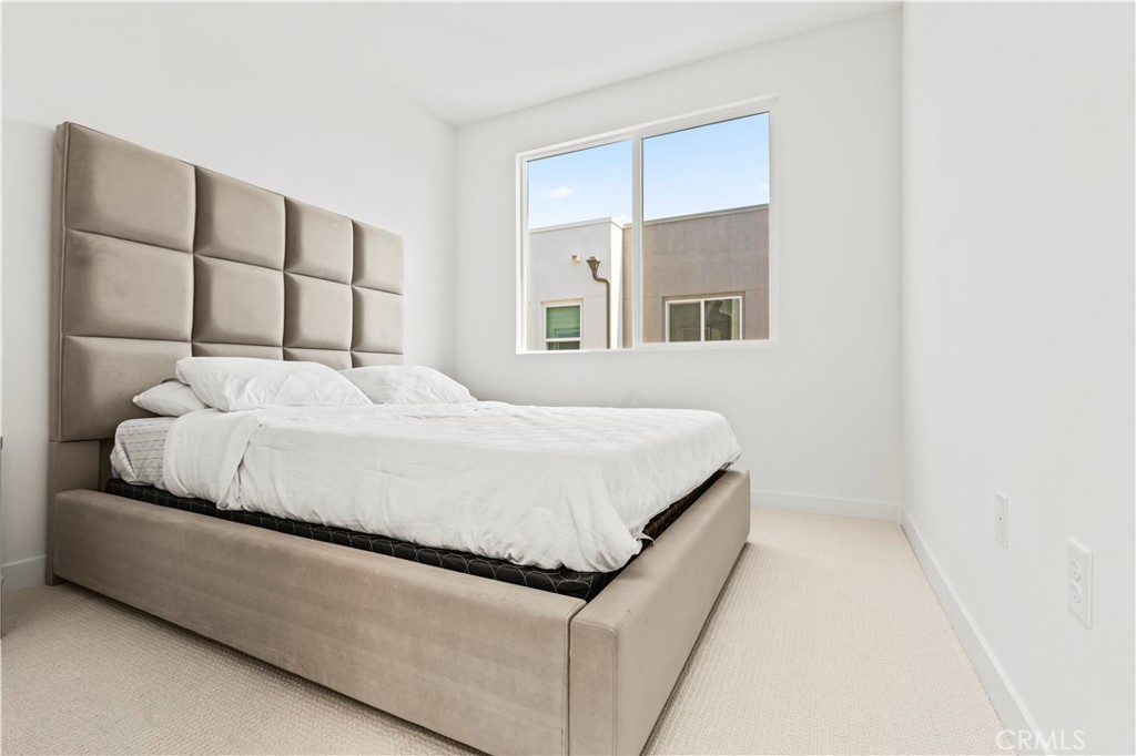 609 South Lyon Street Santa Ana, CA 92705 - Photo 20 of 36 a bedroom with a bed and a window