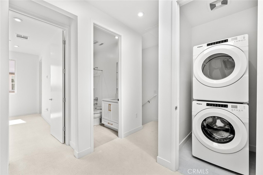 609 South Lyon Street Santa Ana, CA 92705 - Photo 24 of 36 a view of a hallway with washer and dryer