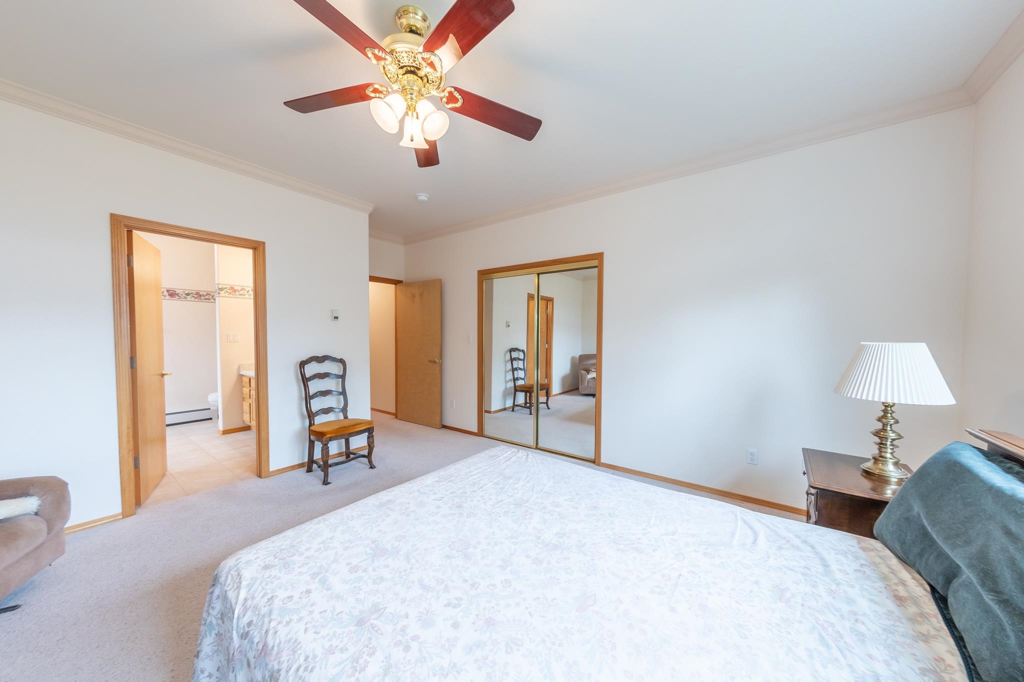 2802 Grand View Circle Grand Junction, CO 81506 - Photo 11 of 21 a bedroom with a bed and a chandelier