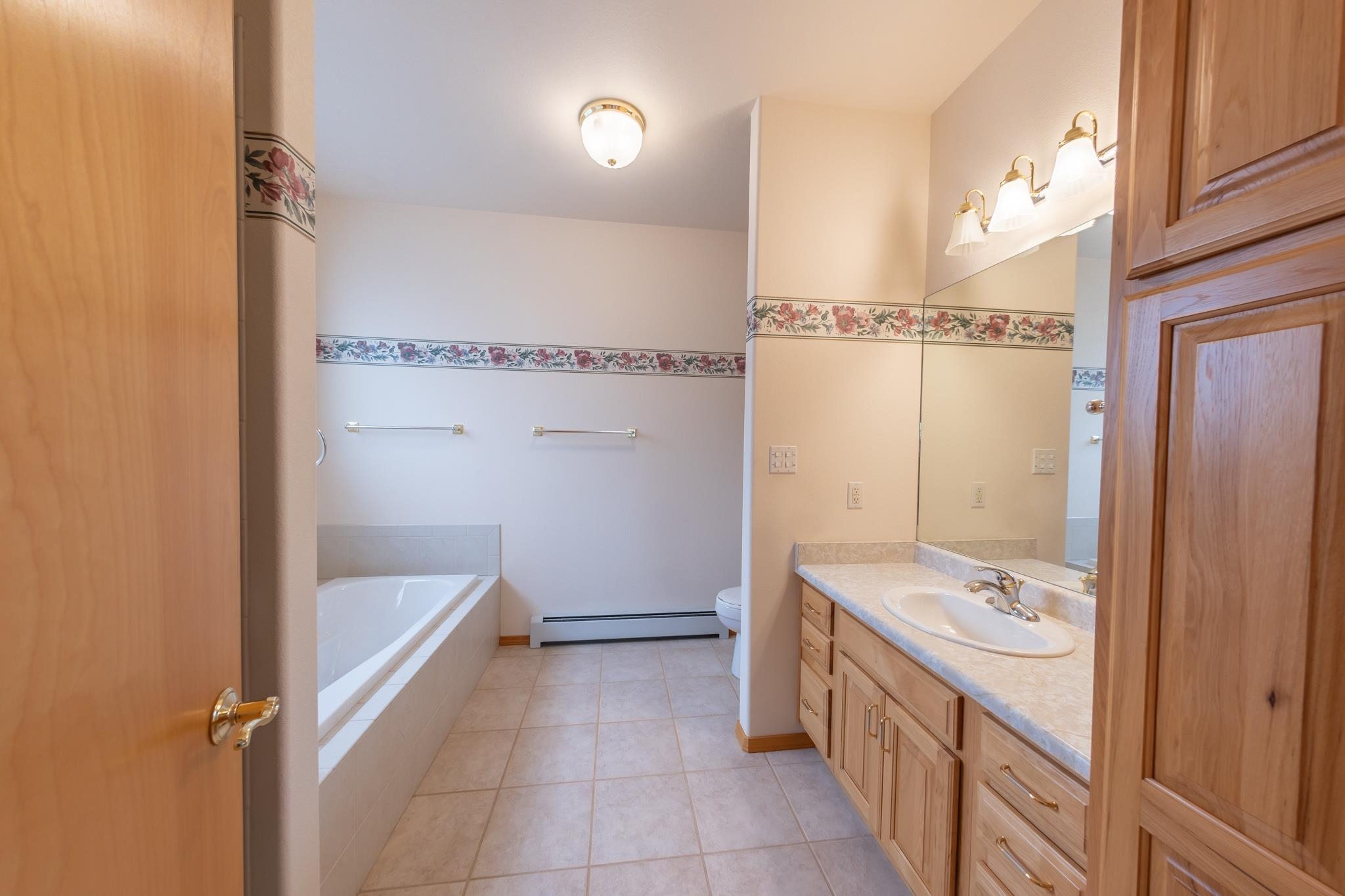 2802 Grand View Circle Grand Junction, CO 81506 - Photo 12 of 21 a bathroom with a granite countertop sink and a mirror