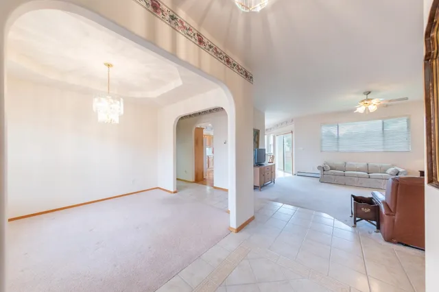 a view of a livingroom with furniture and windows