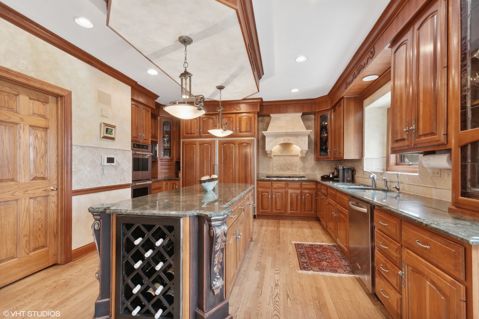 211 Otis Road Barrington Hills, IL 60010 - Photo 13 of 68 a kitchen with stainless steel appliances granite countertop a sink a stove and a wooden floors