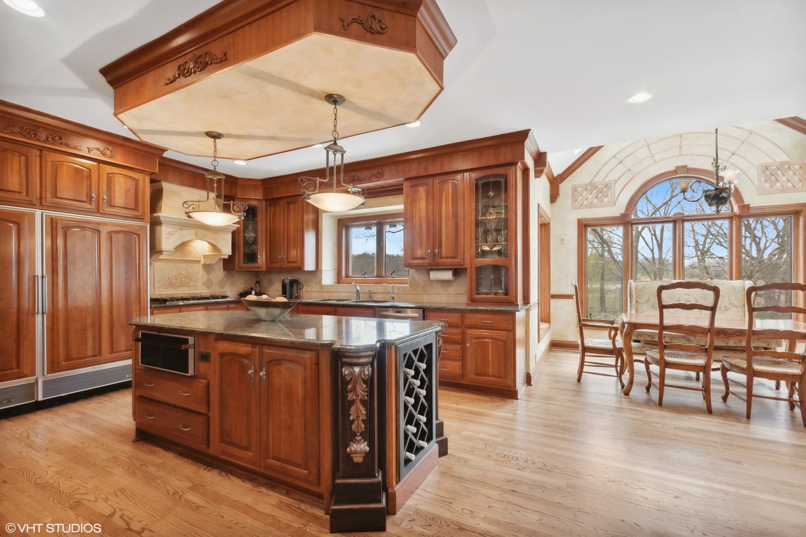 211 Otis Road Barrington Hills, IL 60010 - Photo 15 of 68 a kitchen with stainless steel appliances granite countertop a stove and cabinets