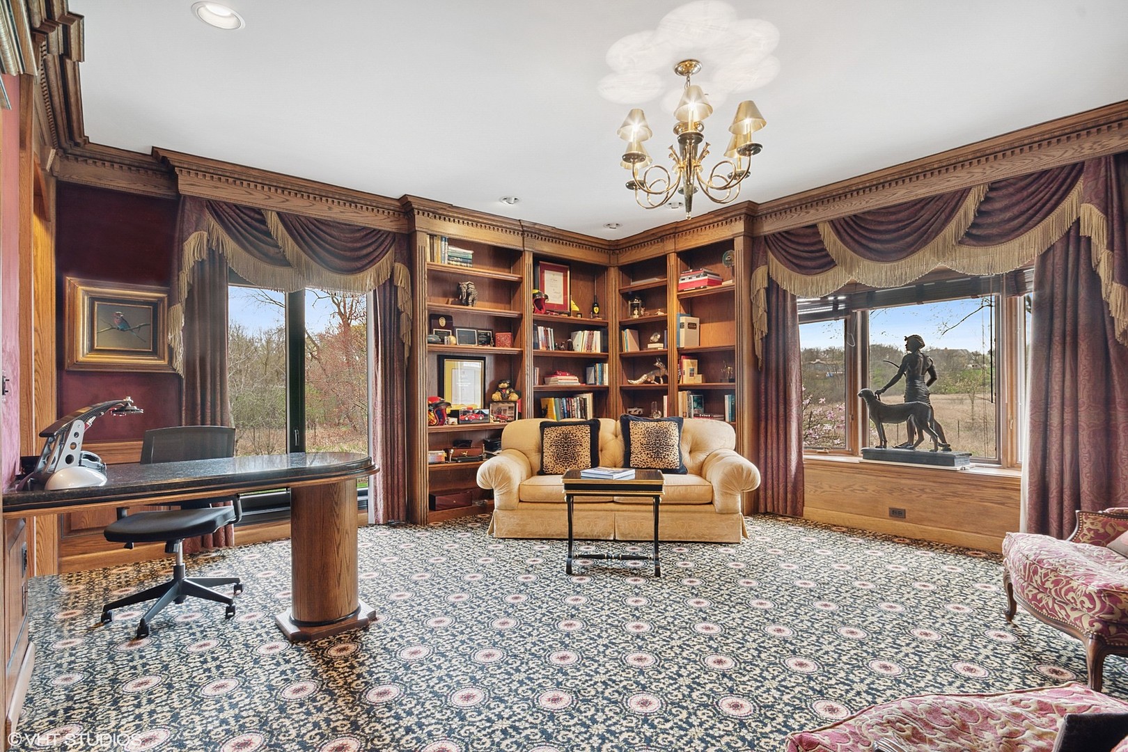 211 Otis Road Barrington Hills, IL 60010 - Photo 21 of 68 a living room with furniture a rug and a chandelier