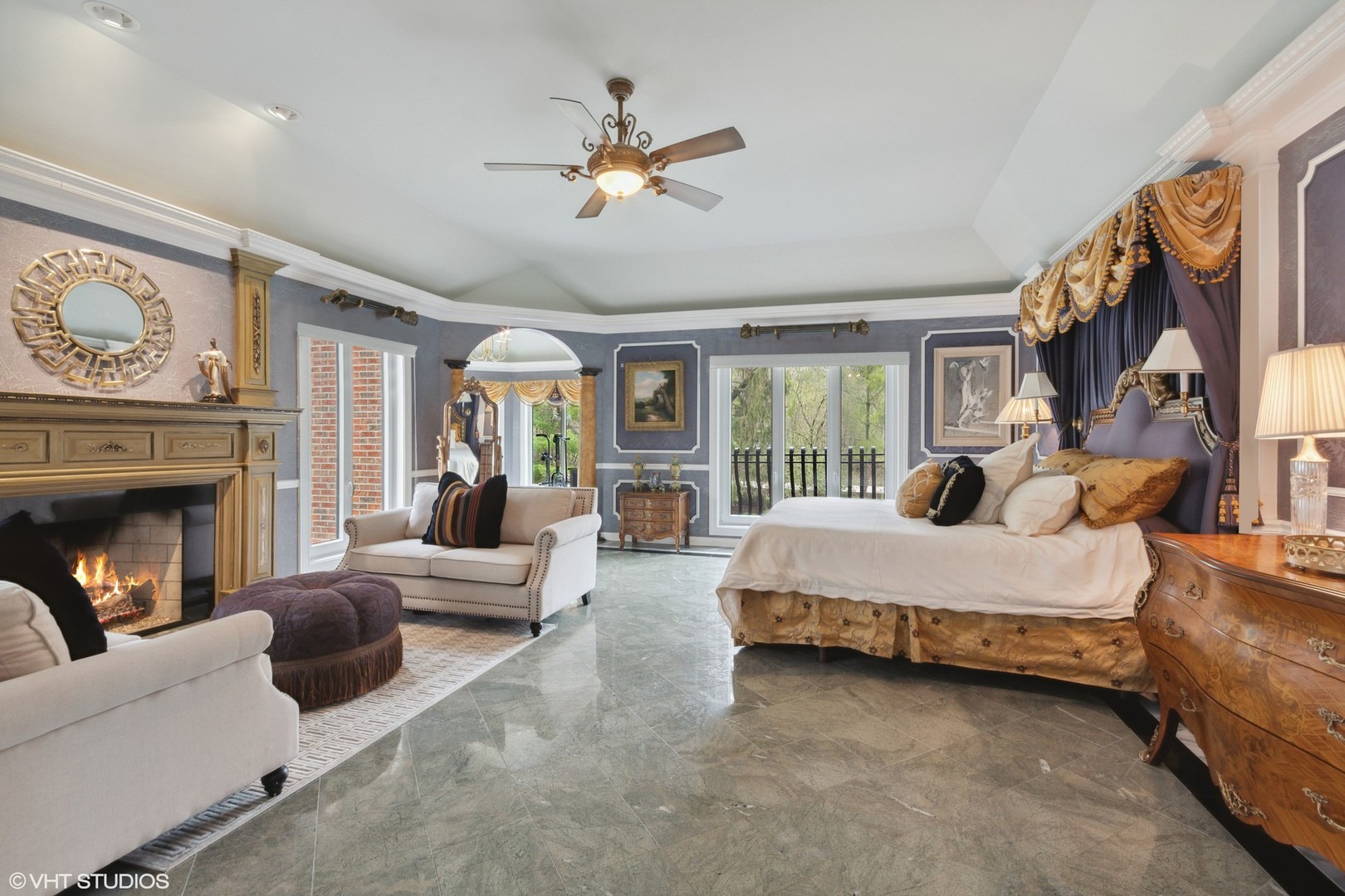 211 Otis Road Barrington Hills, IL 60010 - Photo 28 of 68 a spacious bedroom with a balcony a bed and a couch